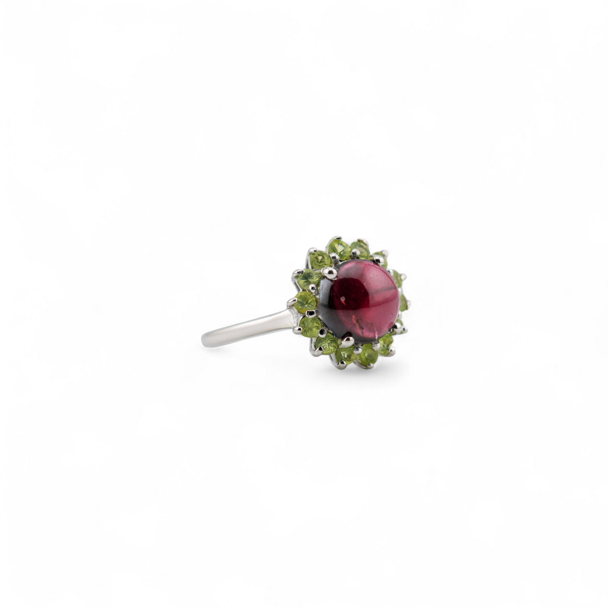 Laxmi garnet and peridot ring