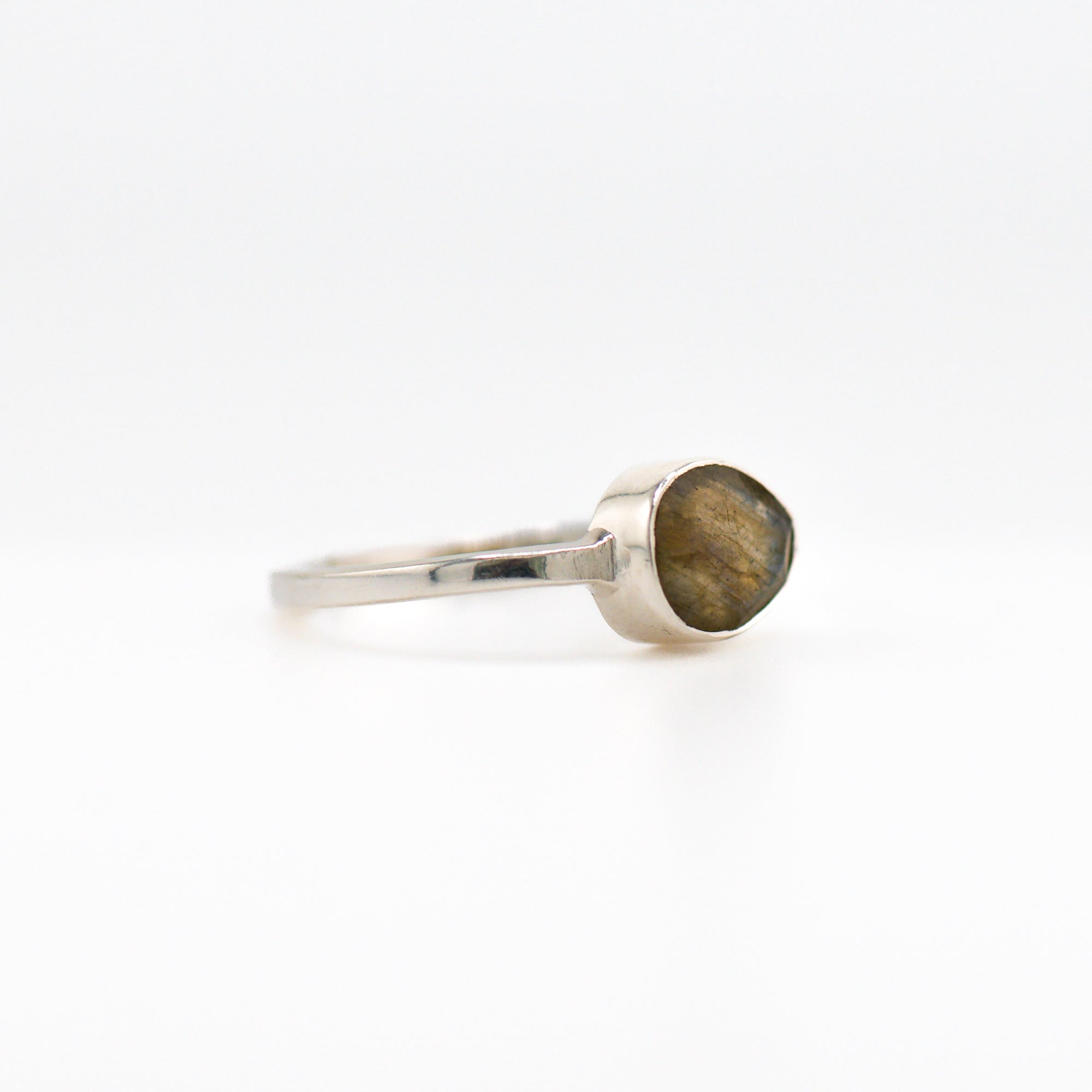 Tilted oval labradorite ring