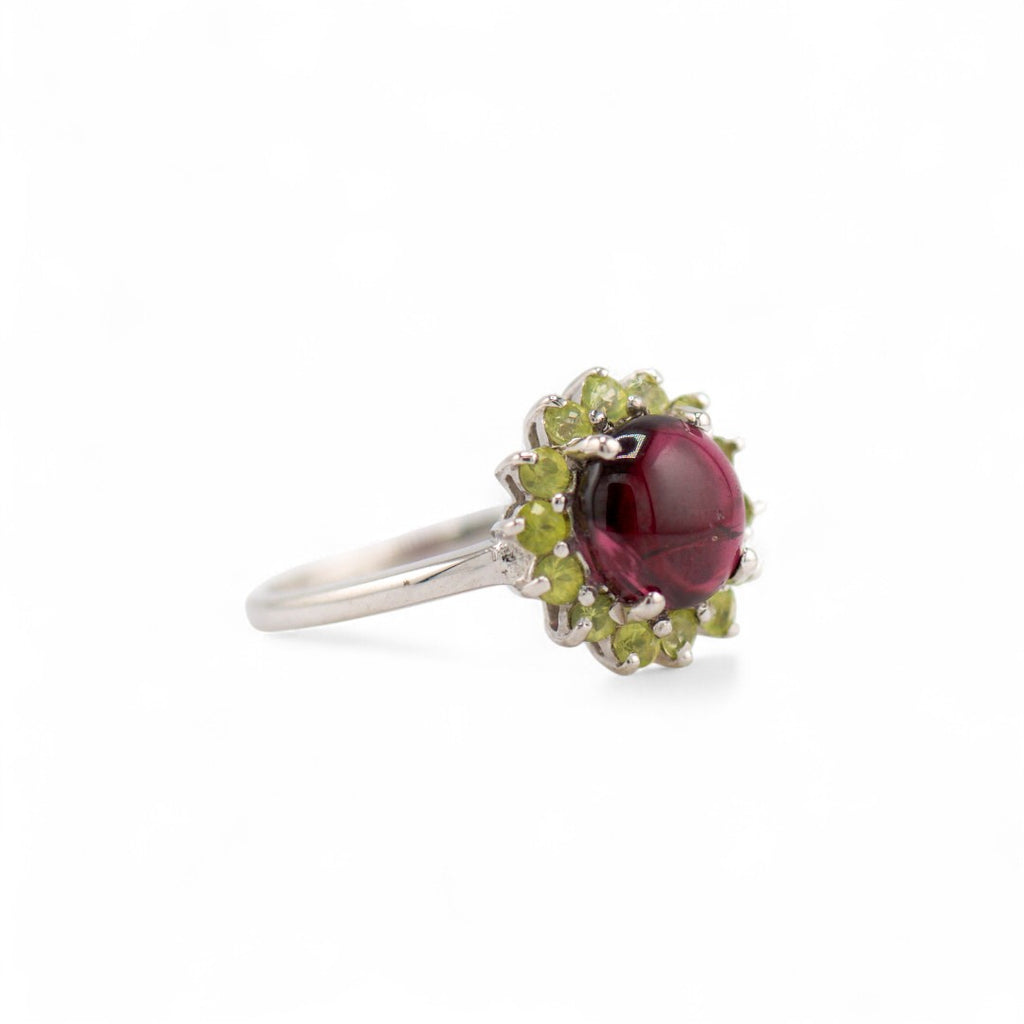 Laxmi garnet and peridot ring